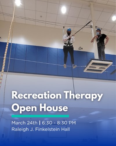 Two recreation therapy students on high ropes course